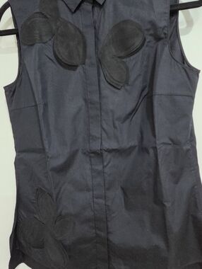 Sleeveless Black Blouse with Petal Appliqués